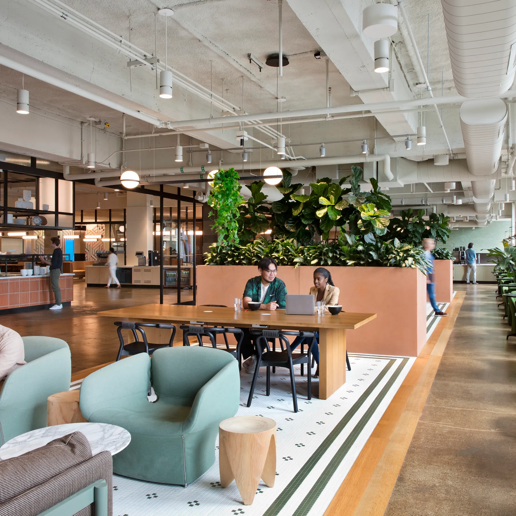custom work table in oak veneer with panel base and power units by Icon Modern