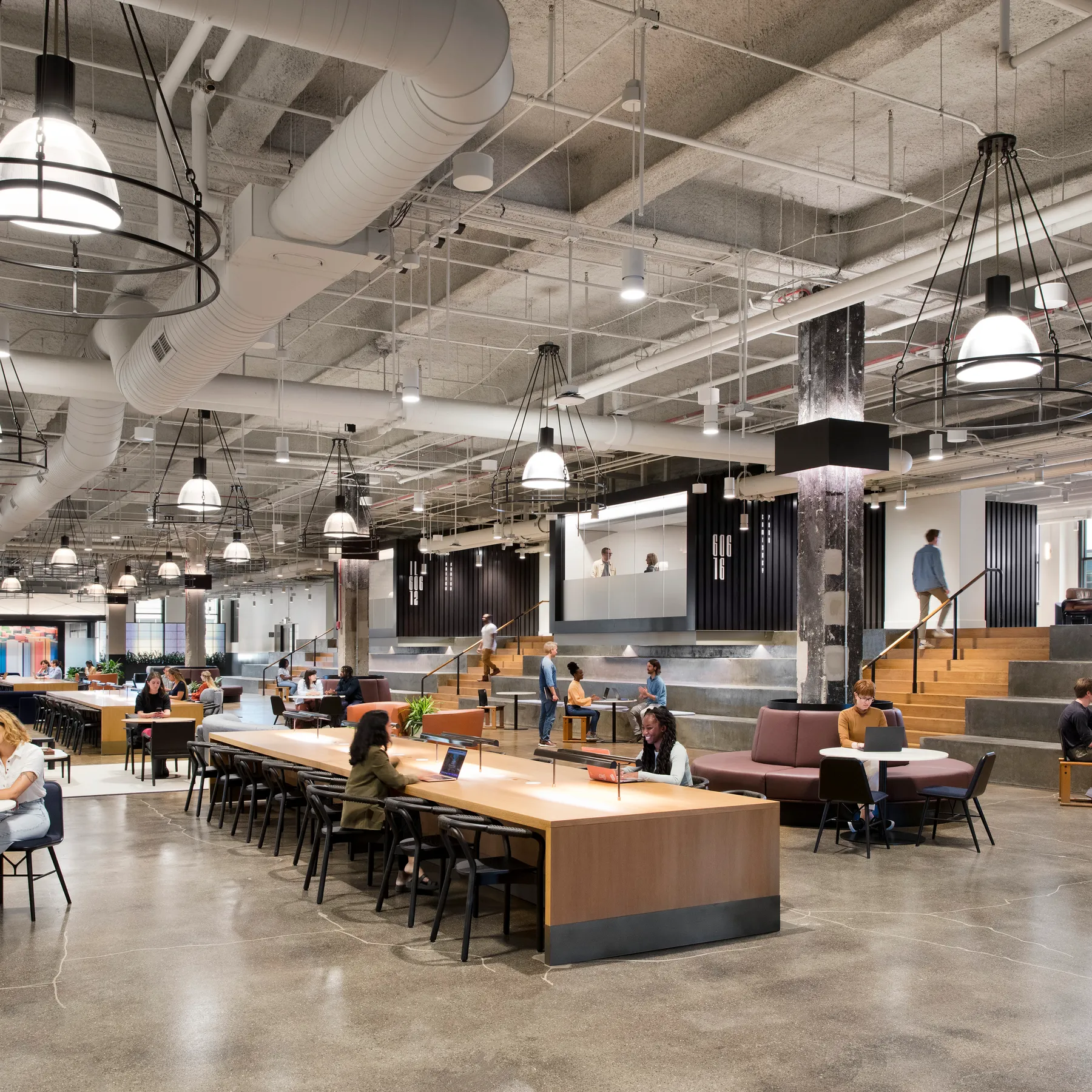 custom library table in oak veneer with power units by Icon Modern