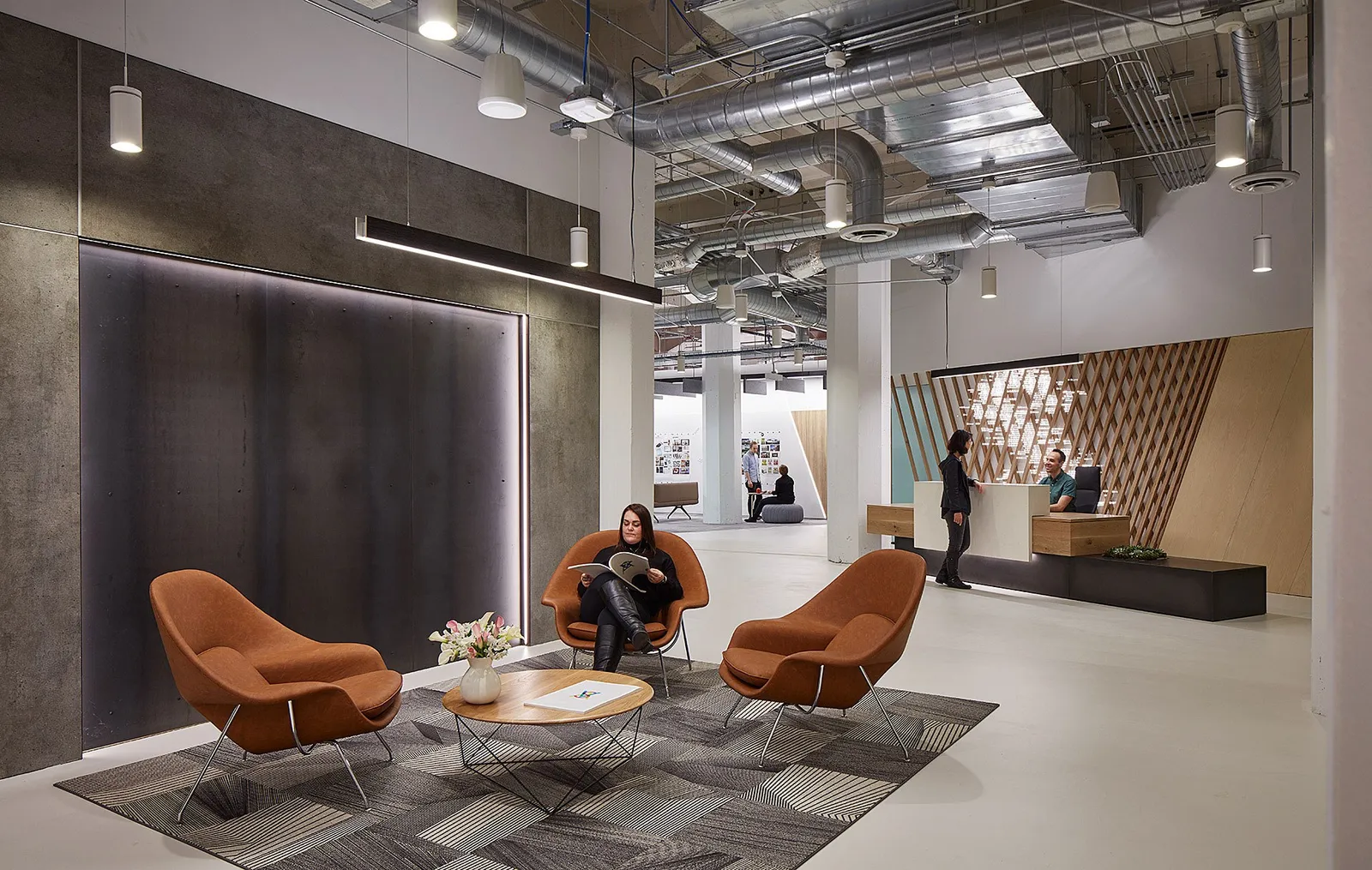 custom reception desk and steel wall panels by Icon Modern