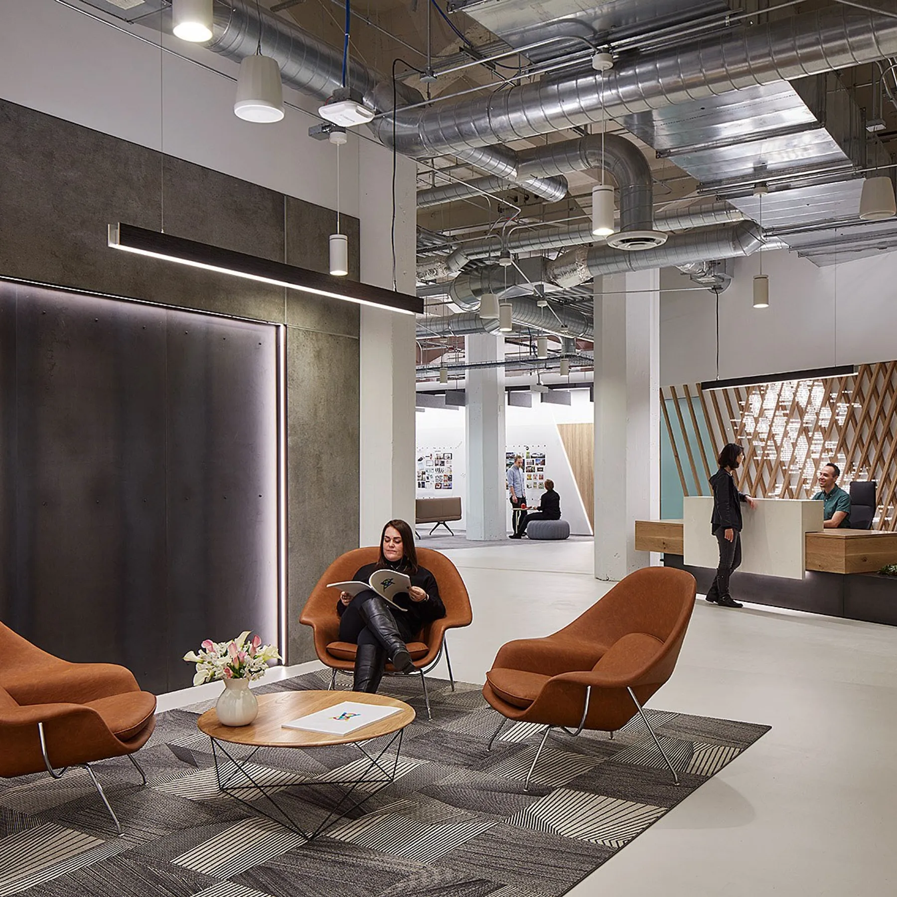 custom reception desk and steel wall panels by Icon Modern