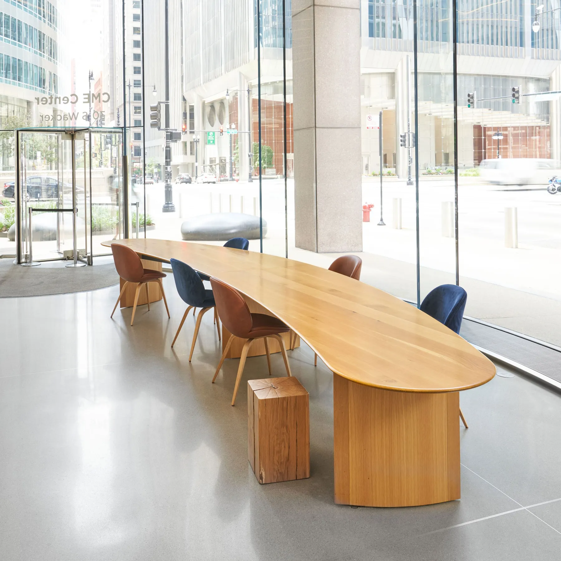 custom community table in urban oak by Icon Modern